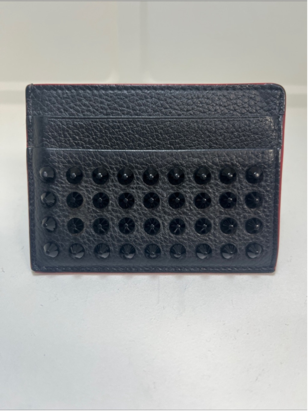 Christian Louboutin Black Leather Studded Card Holder with Red Trim. Chic trendy